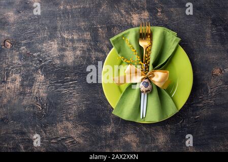 Easter table setting with green plate Stock Photo
