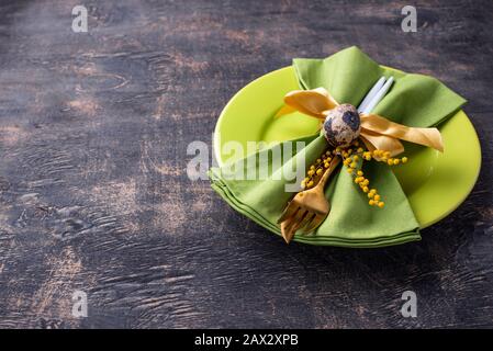 Easter table setting with green plate Stock Photo