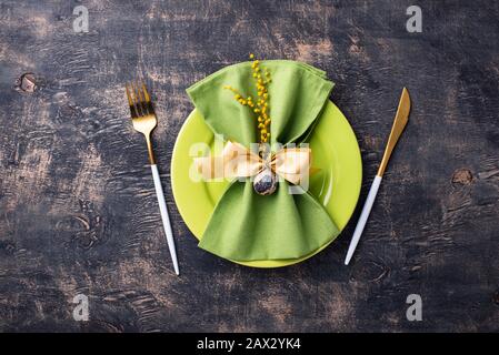 Easter table setting with green plate Stock Photo