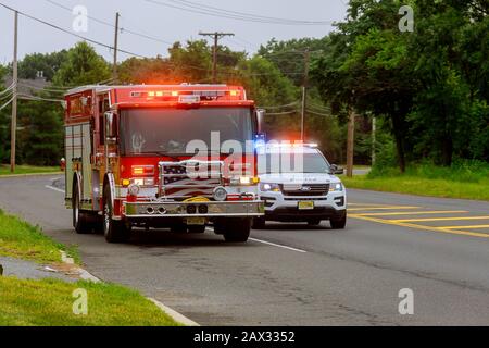 10 February 2020 East Brunswick NJ USA: Fire Trucks in Fire Department on emergency 911 and police car Stock Photo