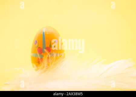 Funny Easter eggs and yellow chicks and Easter bunnies with a white and yellow background, to be used as a postcard or wallpaper Stock Photo