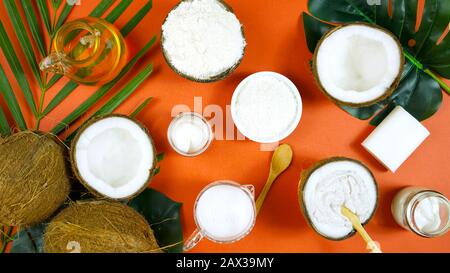 Coconut cosmetics theme flat lay creative layout overhead with pro environment alternative plastic free soaps, moisturizers and beauty products on mod Stock Photo