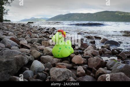 LOCH NESS MONSTER TOY ON THE SHORES OF LOCH NESS SCOTLAND RE MYTH LEGEND NESSIE TOURISM ETC UK Stock Photo