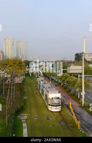 A tram travels on the Haizhu tram system in Guangzhou, China Stock Photo