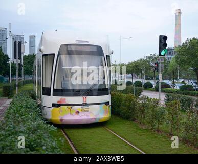 A tram travels on the Haizhu tram system in Guangzhou, China Stock Photo