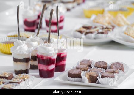 table served several desserts at the party Stock Photo