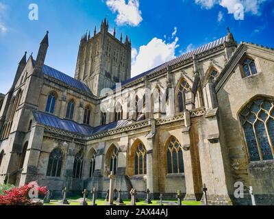 An external view of the gothic Wells Cathedral in Somerset, UK, seat of the Bishop of Bath and Wells showing the tower, transept and choir Stock Photo