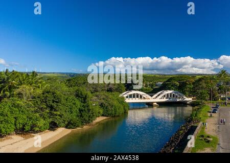 Aerial shot of the river anahulu and the twin arched road bridge in the North Shore town of Haleiwa Stock Photo