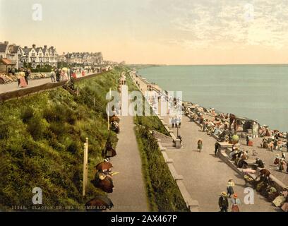 1905  ca. , CLACTON ON SEA , ESSEX  , GREAT BRITAIN  : The cliffs and beach . Promenade looking east . Phocrom print colors edited by Detroit Publishing Co.  Clacton-on-Sea is the largest town on the Tendring peninsula, in Essex, England and was founded in 1871. It is a seaside resort that attracted many tourists in the summer months between the 1950s and 1970s, but which like many other British sea-side resorts went into decline as a holiday destination since holidays abroad became more affordable. These days it is more popular as a retirement location -  GRAND BRETAGNA  - VIEW -  ITALIA - FO Stock Photo