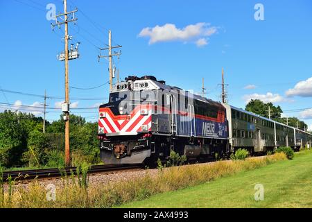 Geneva, Illinois, USA. A Metra locomotive leading an afternoon train bringing commuters home from Chicago.