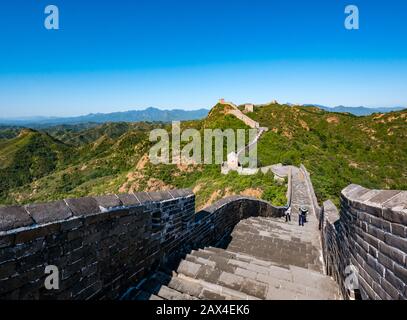 People walking on Ming dynasty Jinshanling Great Wall of China in sunny weather, Hebei Province, China, Asia Stock Photo