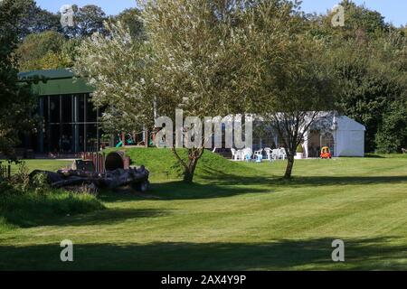 Awarding-winning parkland venue in Ireland, Oakfield Park, Raphoe with Buffers café/restaurant to the left and function marquee. Stock Photo