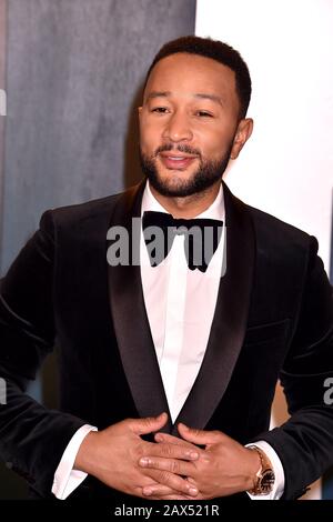 BEVERLY HILLS, CA - FEBRUARY 09: John Legend attends the 2020 Vanity Fair Oscar Party hosted by Radhika Jones at Wallis Annenberg Center for the Performing Arts on February 24, 2019 in Beverly Hills, California. Stock Photo