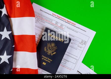 United States Passports and United States voter registration application ready on of American Flag Stock Photo