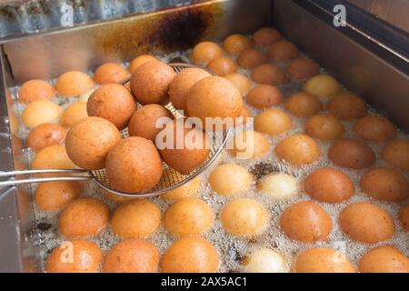 Buñuelos from Colombia in the process of cooking, traditional Colombian food. Stock Photo