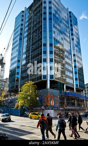 Property development at Seymour and Cordova streets in downtown Vancouver, BC, Canada.  Pedestrians and traffic near a revitalized office building. Stock Photo