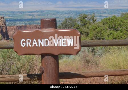 FRUITA, COLORADO - JUNE 23, 2016: Grand View Sign Along Rim Rock Drive in Colorado National Monument With Grand Valley and Book Cliffs in the Distance Stock Photo