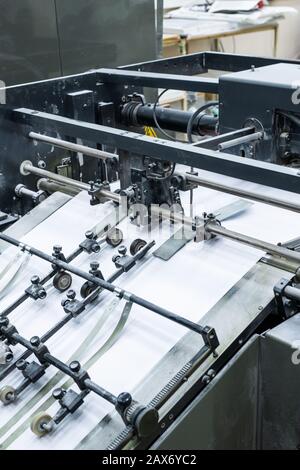 Process of printing at factory: close-up of linotype machine using technology for typesetting text Stock Photo
