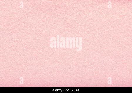 Fine grain pink woolen felt. Texture background. Velvet scarlet matte background of suede fabric. Stock Photo