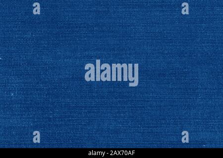 Blue fiber texture polyester close-up. tissue structure closeup. fine grain felt fabric background. Stock Photo