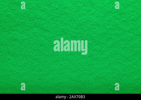 shaggy surface. Fine grain felt green fabric. artificial grass. fleecy texture background. Stock Photo