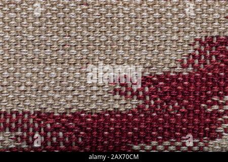 Beige red canvas texture background. Highly detailed photograph of fabric. Stock Photo