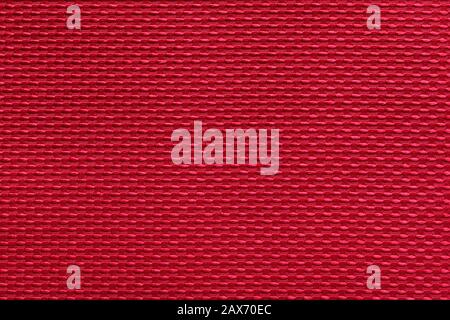 fabric with abstract pattern. red fiber texture polyester close-up. fine grain felt fabric background. Stock Photo