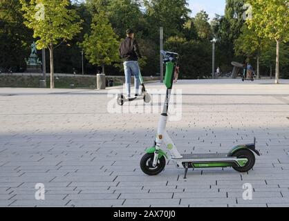 DüSSELDORF, GERMANY - Sep 09, 2019: 09 September 2019 - Düsseldorf, Germany: One of the many e-scooters in Düsseldorf standing in the center, while a Stock Photo