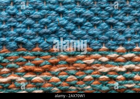 brown, white, green and blue color. fine grain felt fabric background. Mesh texture, design pattern. Stock Photo