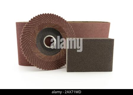 Set of different tools for grinding - sanding belt, abrasive sponge and flap disc for angle grinder, isolated on white background Stock Photo