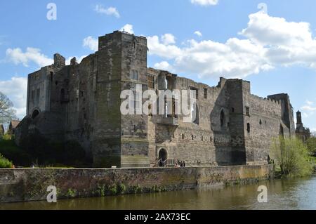 HIstoric, abandoned ruins of Newark Castle as seen from across the River Trent in Newark, England, United Kingdom on a sunny day with a few clouds in Stock Photo