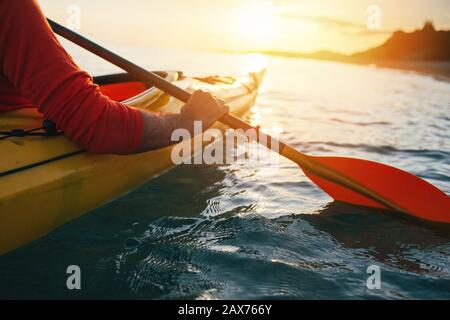 Close up of man holding kayak paddles Stock Photo
