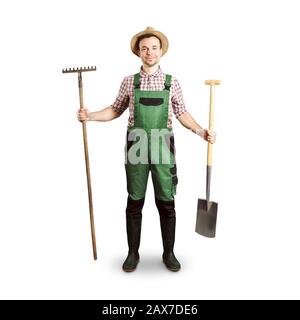 Happy gardener holding a rake and a spade - white background Stock Photo