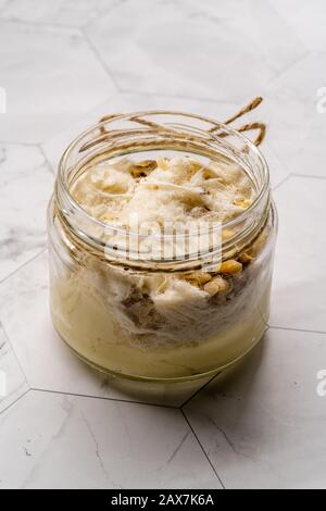 Turkish Traditional Cotton Candy Pismaniye with Custard Pudding in Magnolia Dessert Cup. Ready to Eat. Stock Photo