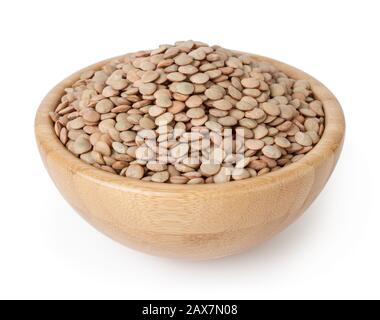 Uncooked lentils in wooden bowl isolated on white background with clipping path Stock Photo