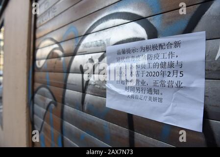 A Chinese shop is closed in Usera district.After the outbreak of Coronavirus in China, Chinese residents at Usera district in Madrid have closed hundreds of shops, hairdressers, restaurants and more for fear that they and clients will not get infected with the virus. The city of Madrid has 38,547 Chinese residents, according to official statistics. A quarter of the community has settled in this district. Stock Photo