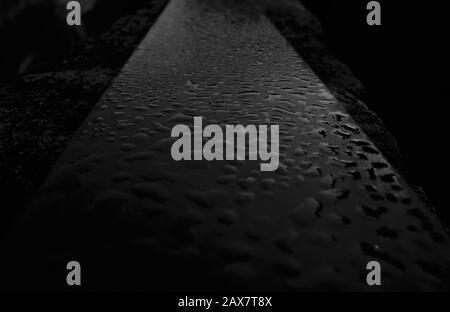 Dew drops on a granite slate, granite, stone, black and white Stock Photo