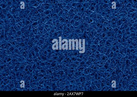 Close-up detail deep classic blue plastic doormat texture. Neutral abstract backdrop surface. Color of the year 2020 pattern Stock Photo