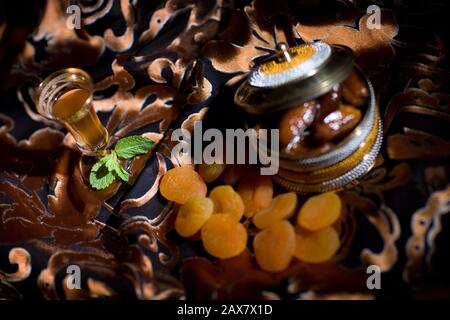 After meal Arabian delicacies, dates & Gawa (Arabian coffee). Stock Photo