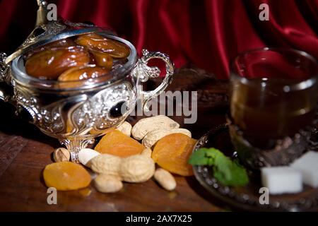 After meal Arabian delicacies, dates & gawah (Arabian coffee). Stock Photo