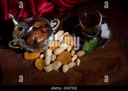 After meal Arabian delicacies, dates & gawah (Arabian coffee). Stock Photo