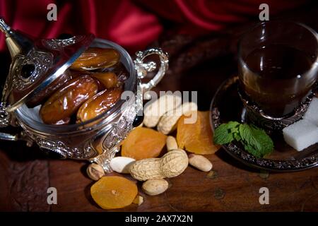 After meal Arabian delicacies, dates & gawah (Arabian coffee). Stock Photo