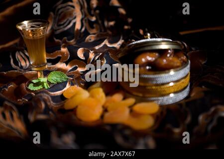 After meal Arabian delicacies, dates & Gawa (Arabian coffee). Stock Photo