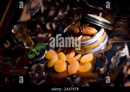 After meal Arabian delicacies, dates & Gawa (Arabian coffee). Stock Photo