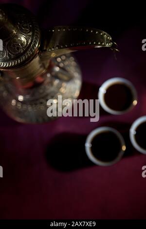 After meal Arabian delicacies, dates & gawah (Arabian coffee). Stock Photo