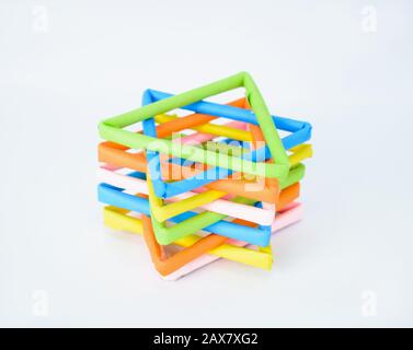 Five different colored stars made of different colored papers isolated on a white background Stock Photo