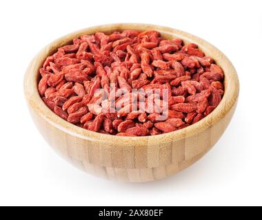 Dried goji berries in wooden bowl isolated on white background with clipping path Stock Photo