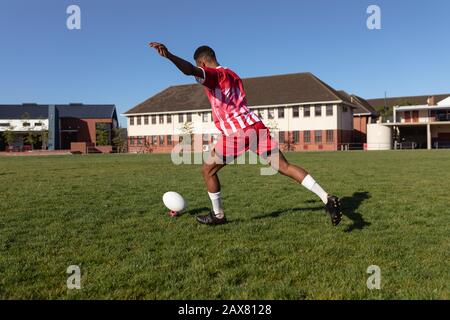 Rugby player shooting in the ball Stock Photo