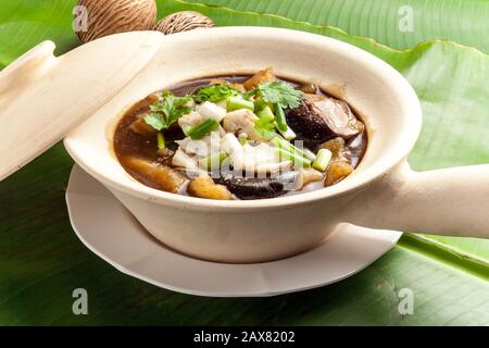 Braised Fish Maw in Red Gravy, Fish maw soup in bowl Stock Photo