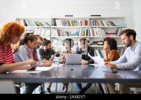 Creative managers crew working with new startup project in office. Team brainstorming. Stock Photo